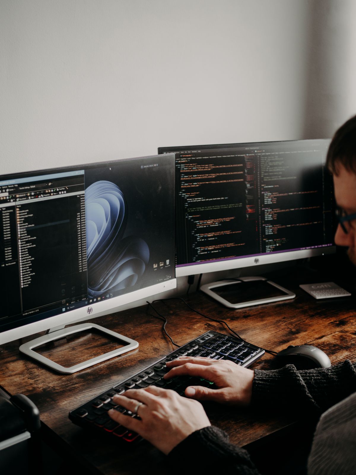 Developer working across two screens